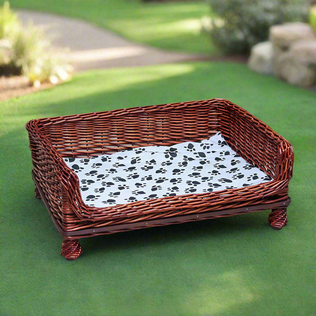 Handcrafted Wicker Outdoor Indoor Pet Bed with Paw-Print Cushion.