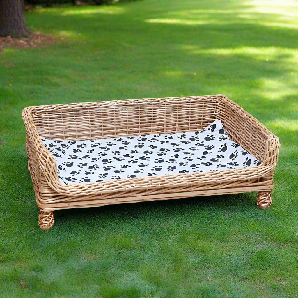 Handcrafted Wicker Outdoor Indoor Pet Bed with Paw-Print Cushion.